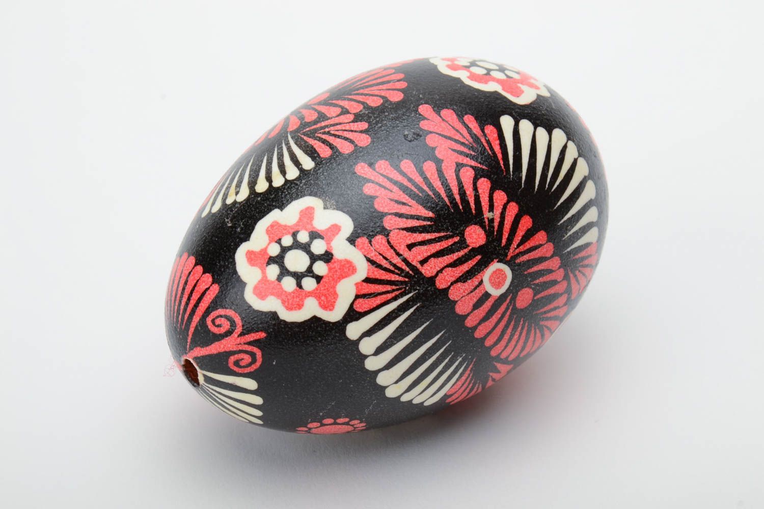 Handmade decorative painted Easter egg with ornament on black background photo 2