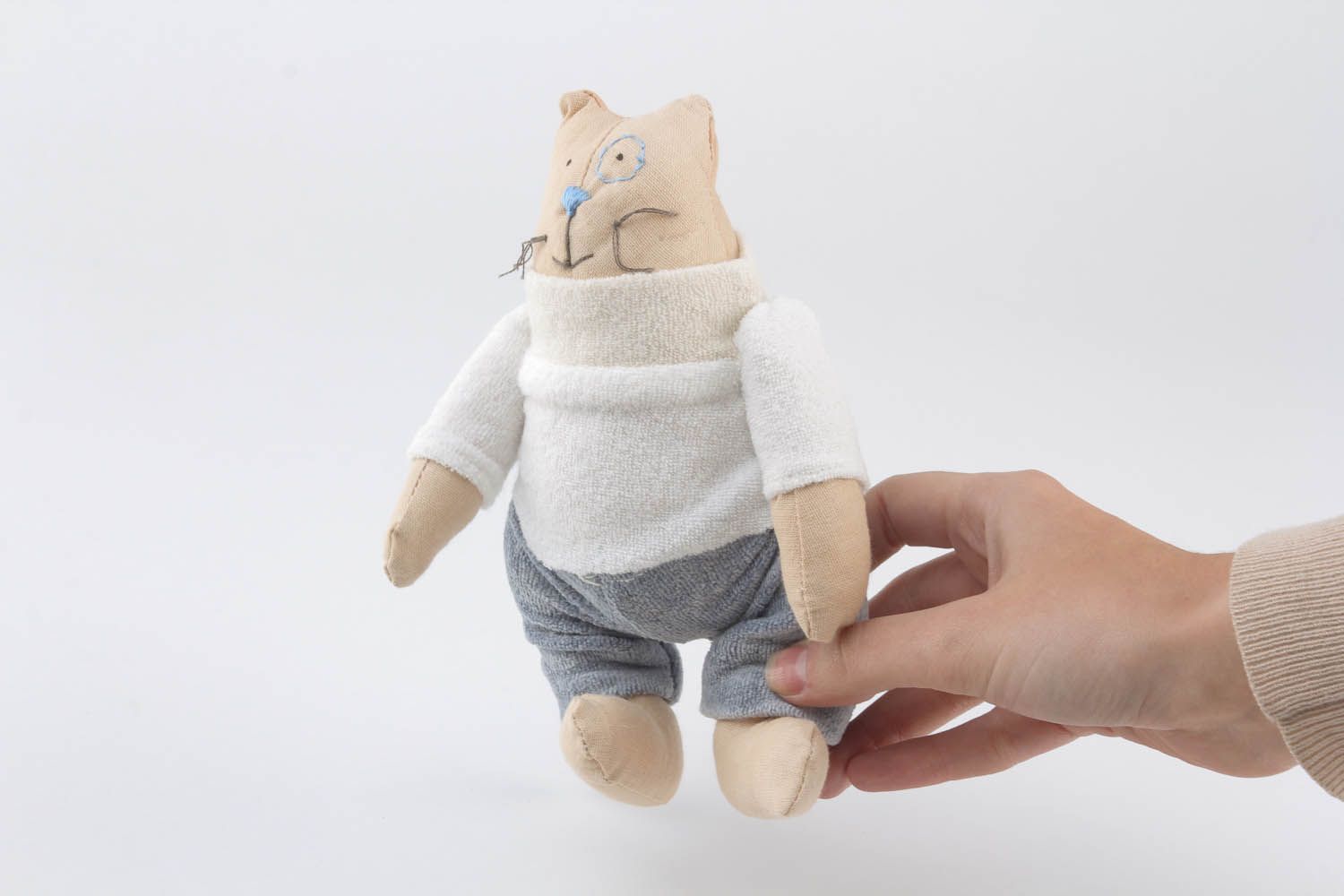 Soft toy in the shape of a cat photo 1