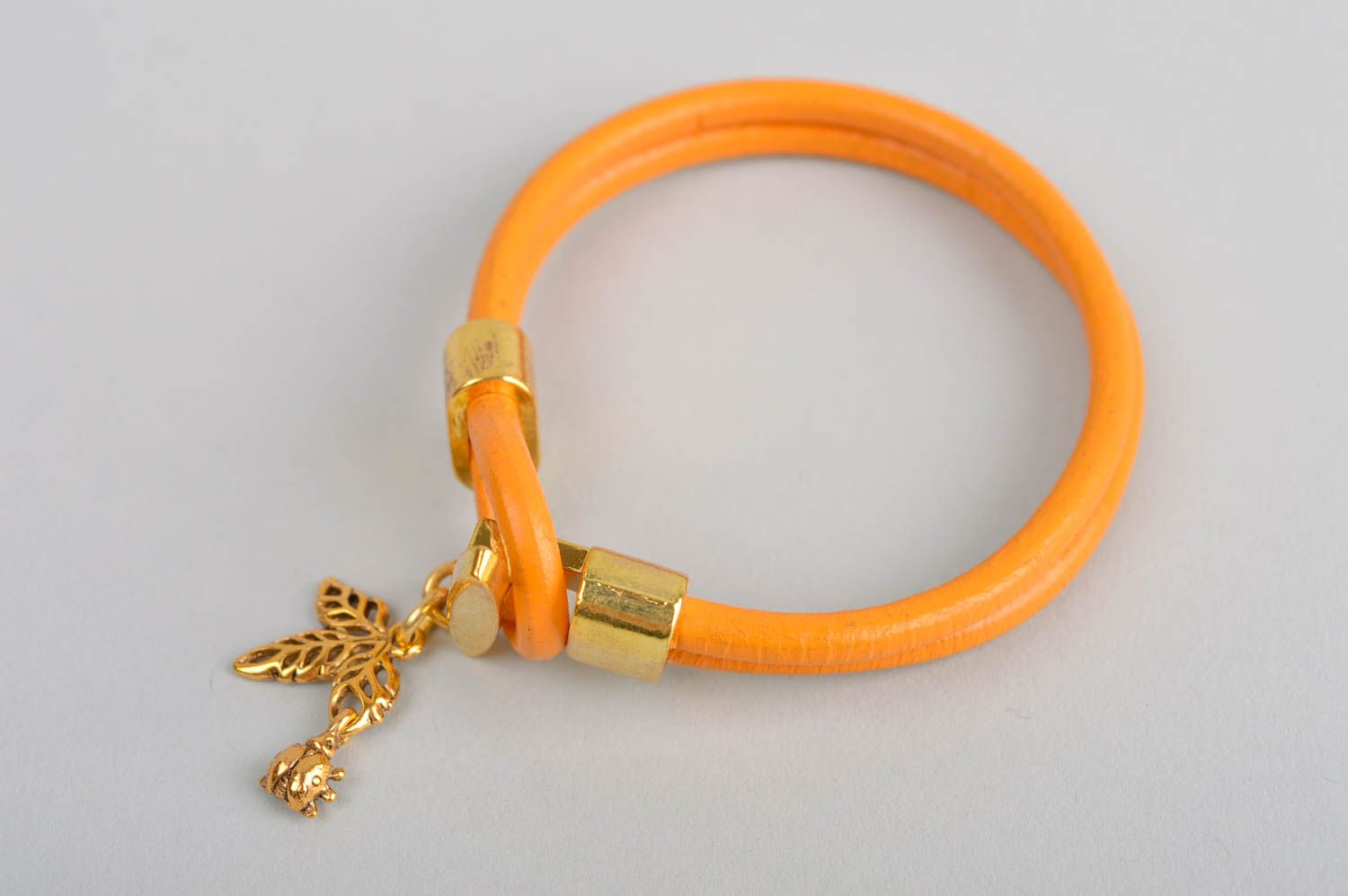 Украшение из кожи ручной работы браслет на руку оранжевый кожаный браслет фото 2