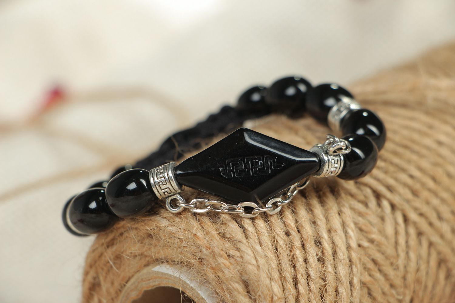 Woven bracelet with black beads photo 4
