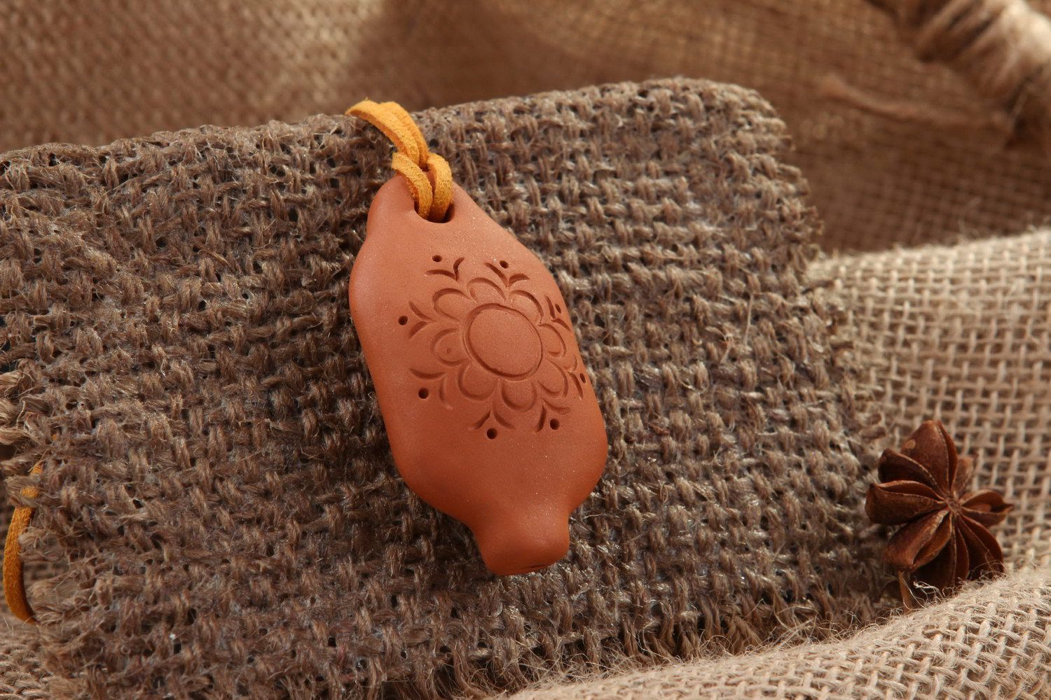 Tin whistle pendant made of clay with flower photo 1