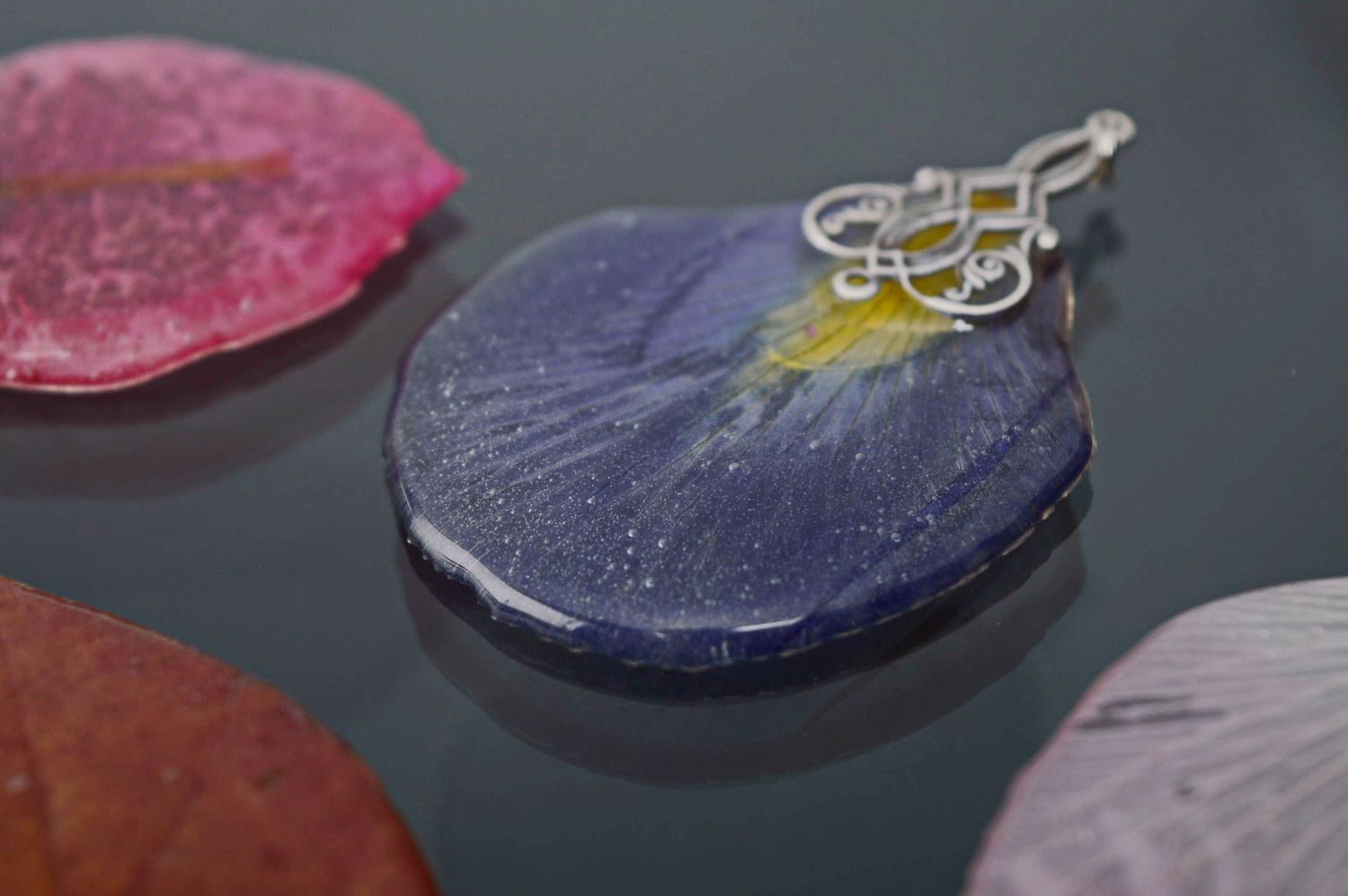 Women's neck pendant with iris petal embedded in epoxy resin photo 1