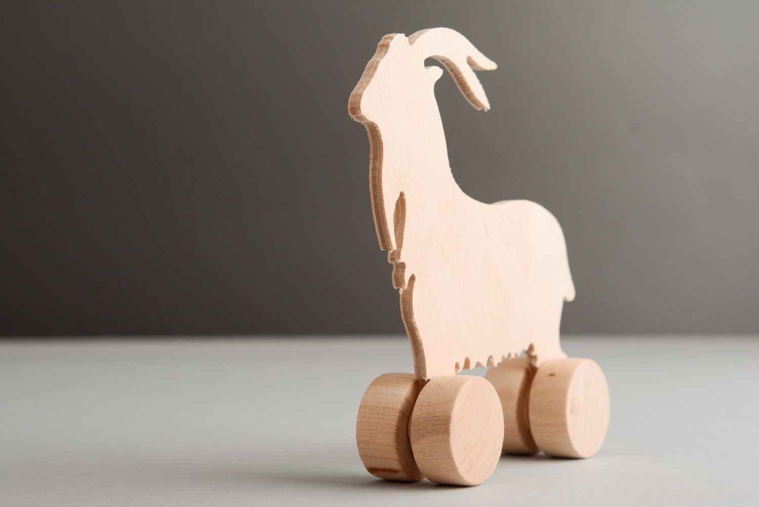 Wooden toy with wheels Goat photo 2
