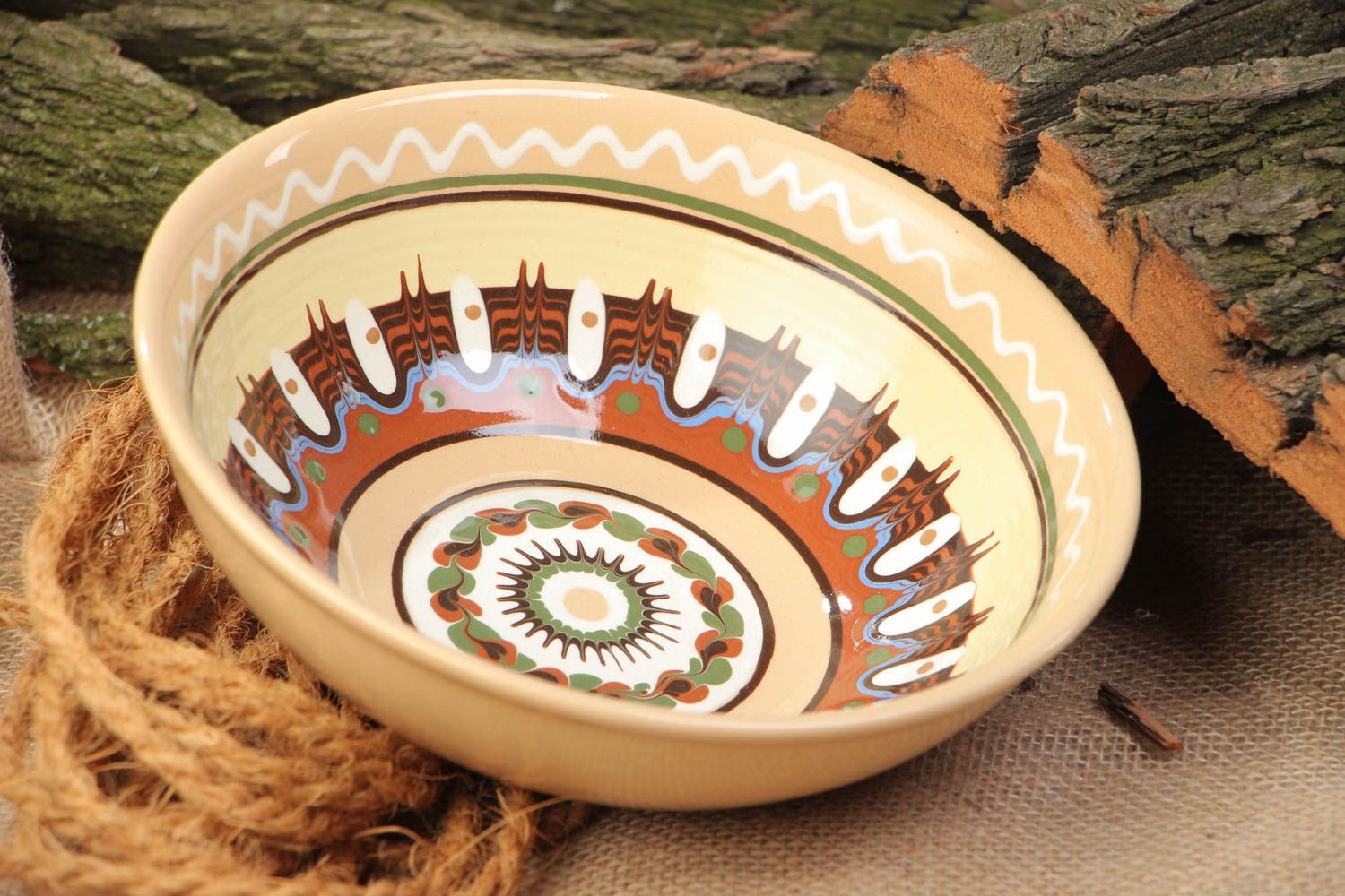 Homemade decorative ceramic bowl painted with glaze in ethnic style for 600 ml photo 1