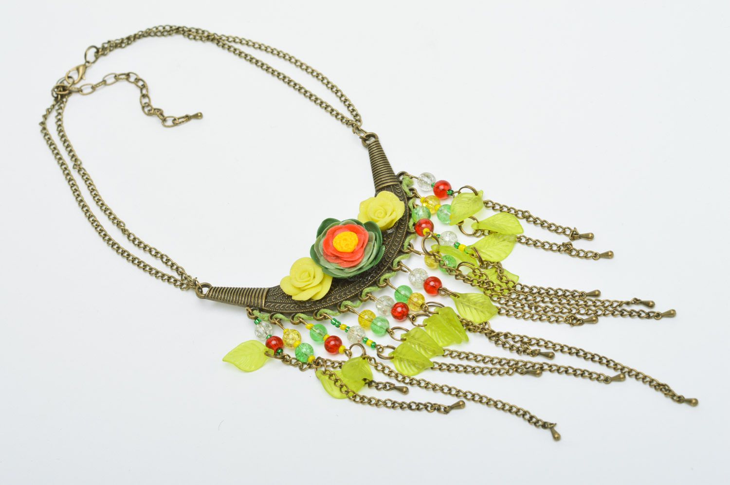 Handmade yellow metal and polymer clay necklace with charms photo 2