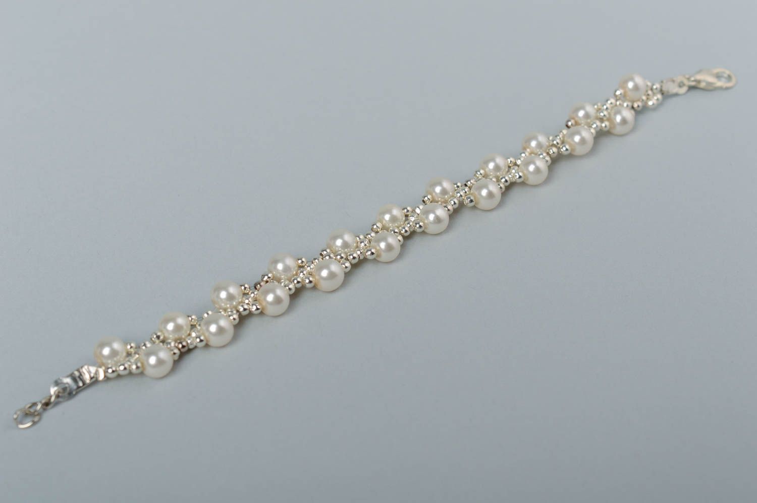 Stylish handmade designer artificial pearl beaded bracelet of white color photo 2
