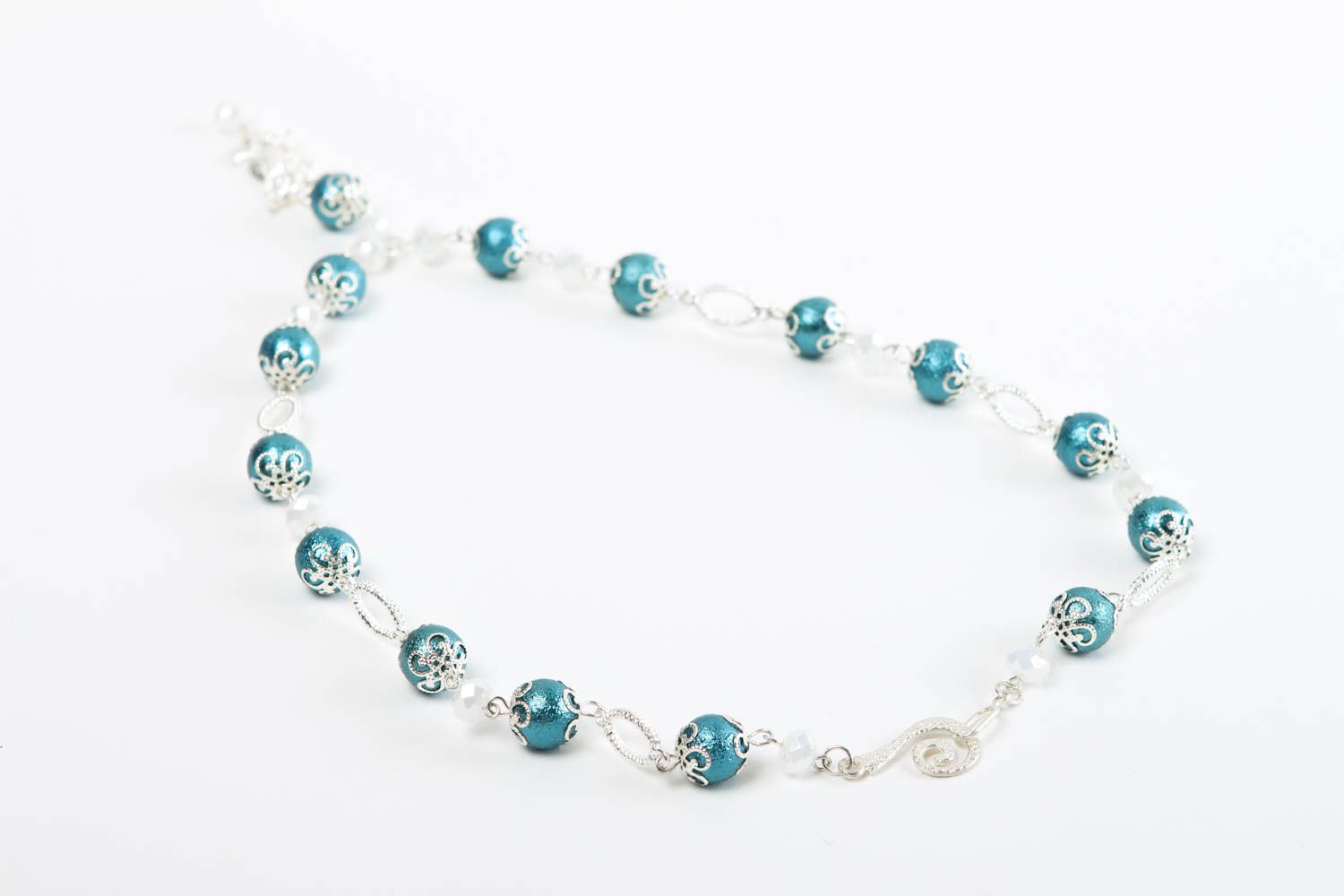 The handmade light beaded bracelet on silver string with blue beads photo 4