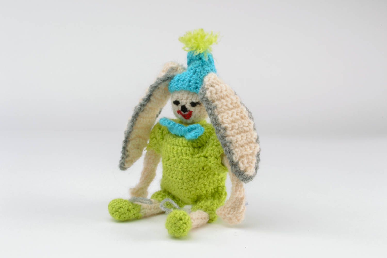 Soft toy hare in green photo 4