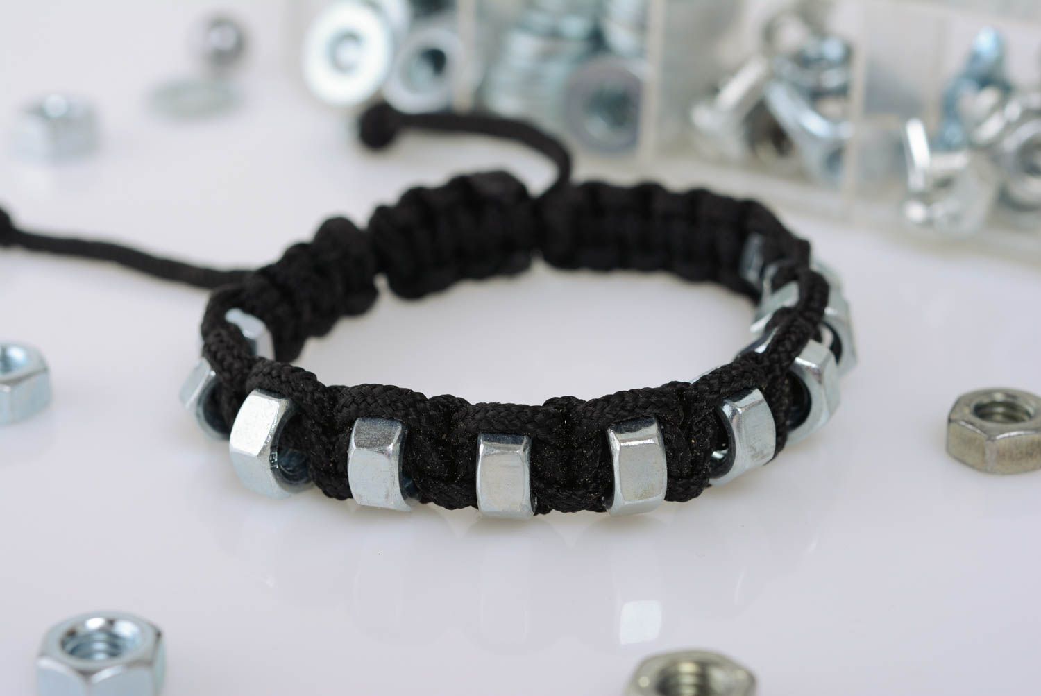 Black handmade designer woven cord bracelet with corrosion resistant nuts photo 1