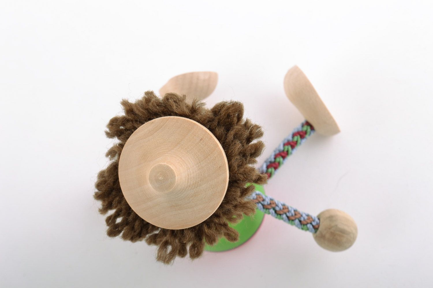 Brightly painted homemade wooden eco toy boy with hat for children and interior photo 4
