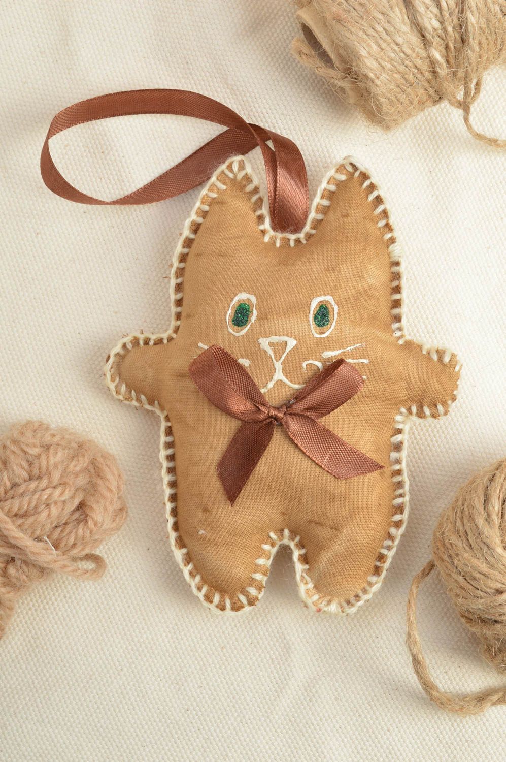 Handmade small brown fabric wall hanging soft toy with eyelet cat with bow photo 1