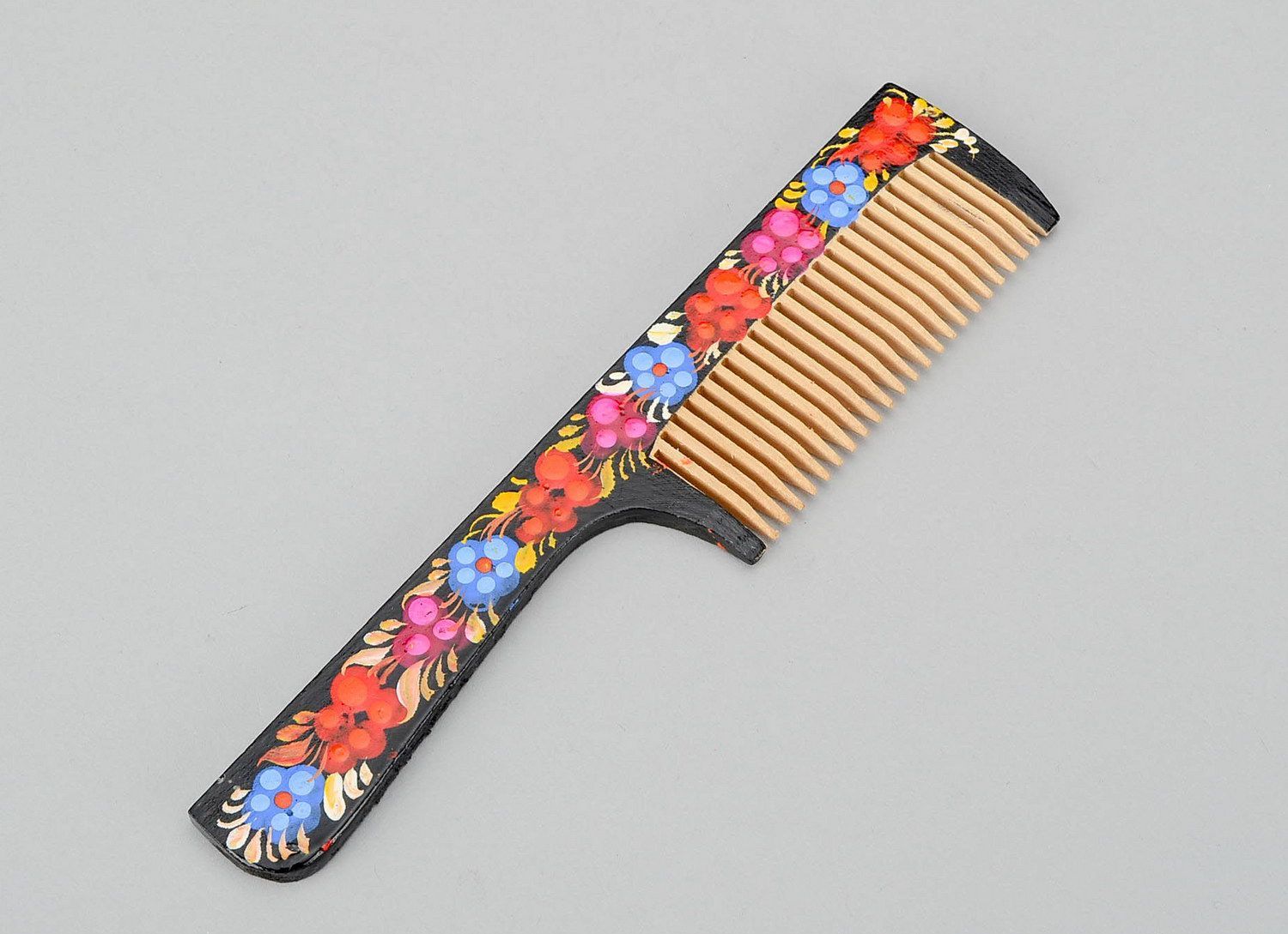 Wooden comb with painting photo 1