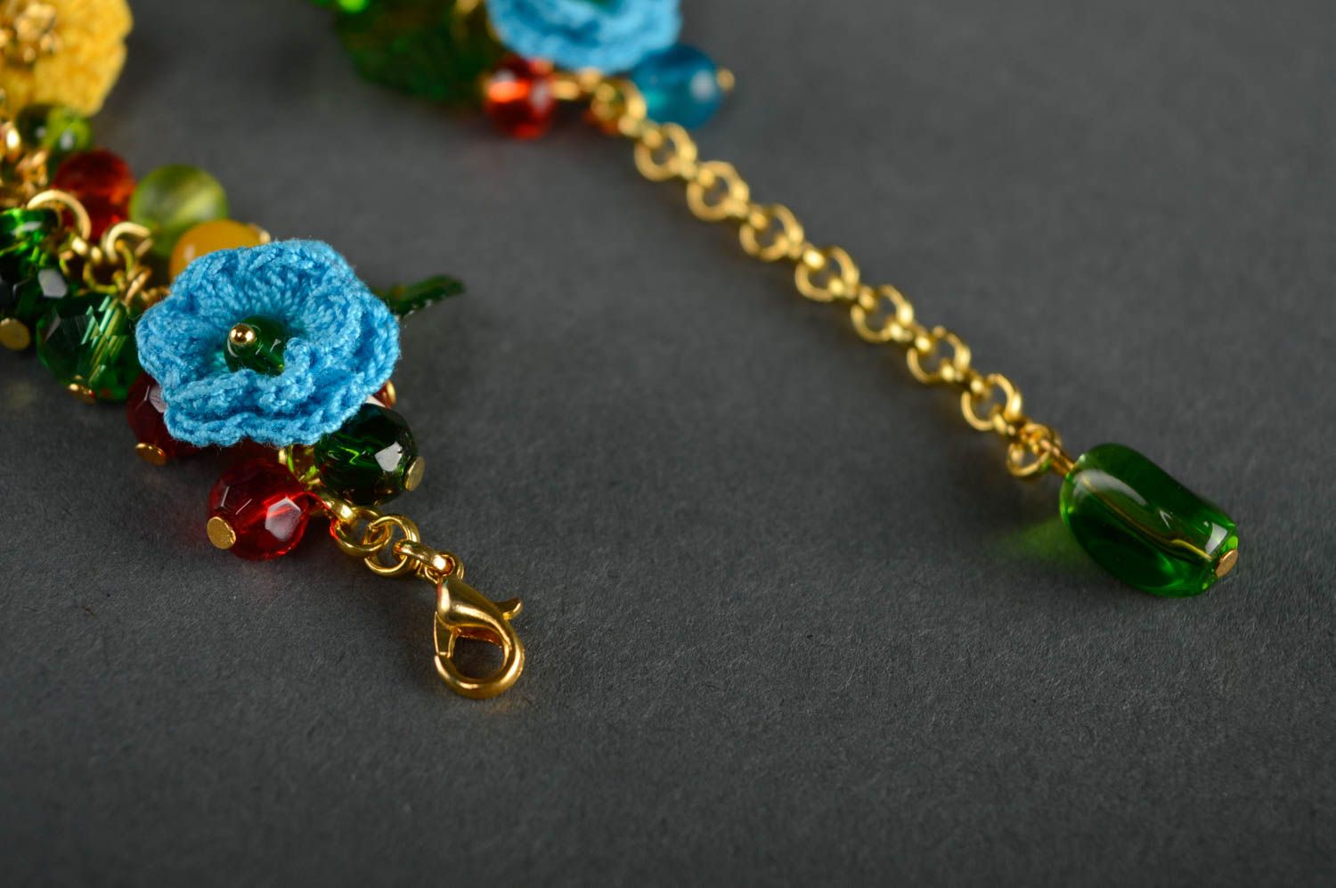 Bright beautiful crochet bracelet with charms and flowers photo 4