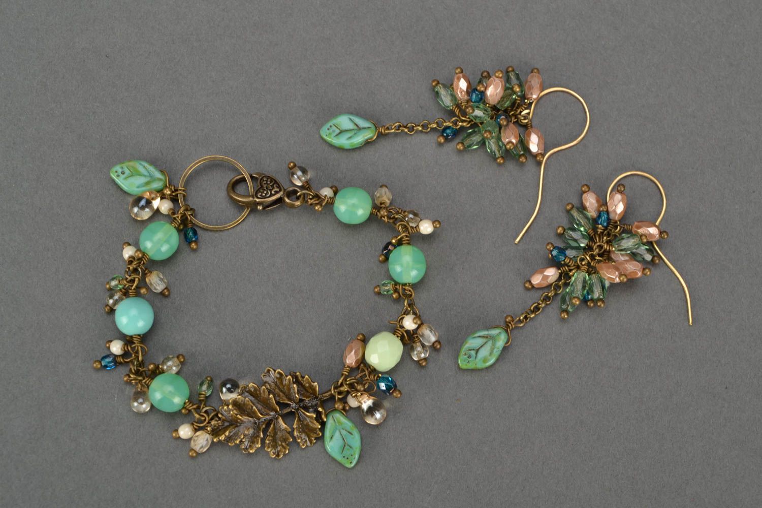 Female beautiful handmade jewelry made of glass beads bracelet and earrings photo 1