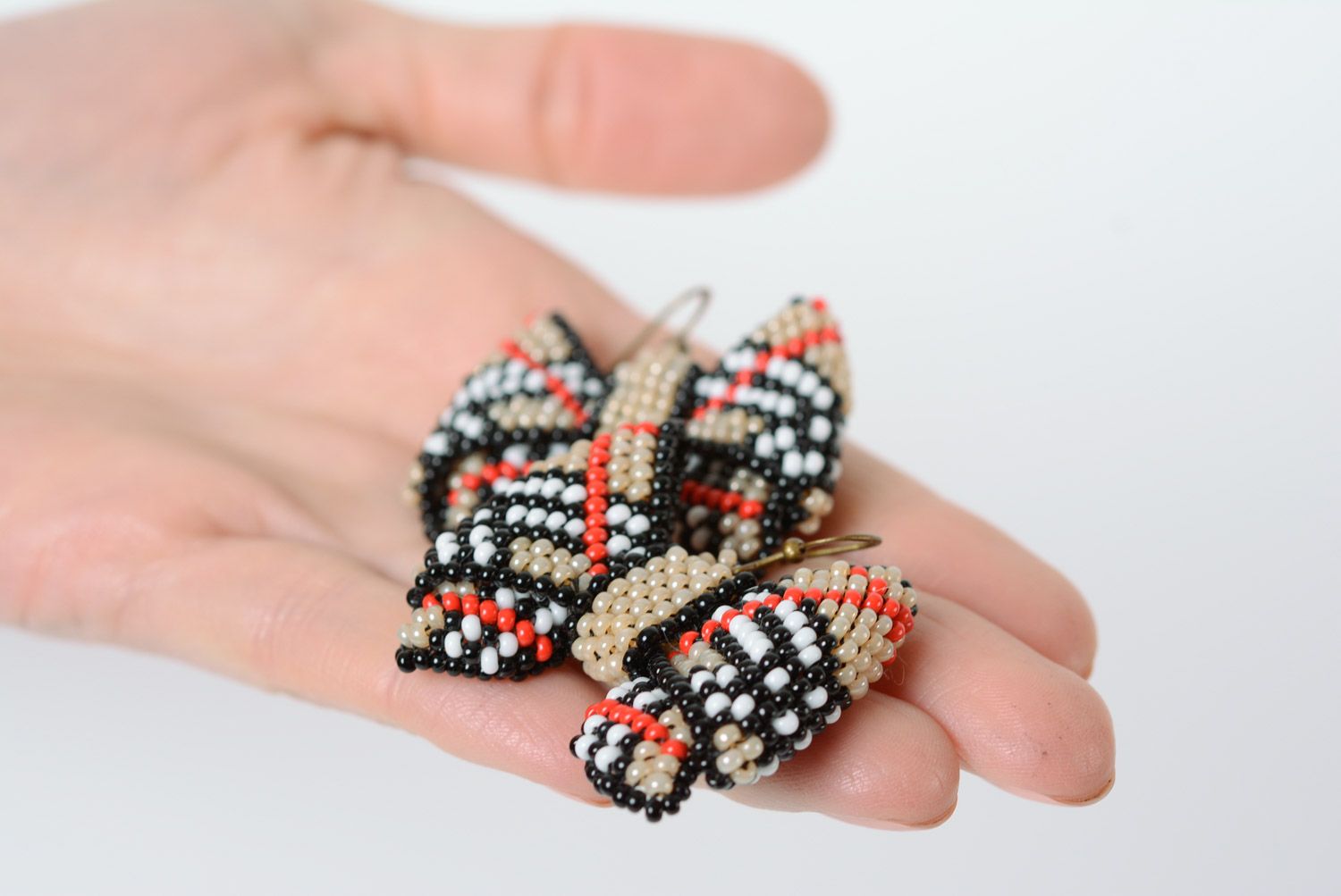 Handmade dangle earrings woven of beads beige checkered bows for girls photo 3