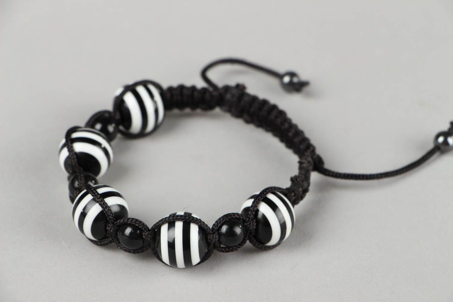 Black and white braided bracelet with beads photo 4
