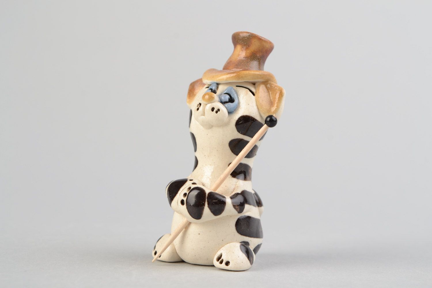Handmade miniature ceramic figurine of cat illusionist painted with glaze photo 1