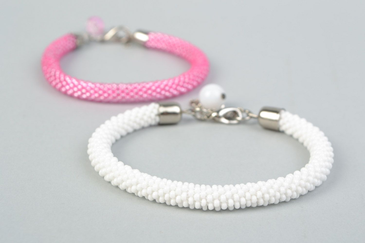 Set of 2 handmade beaded cord women's wrist bracelets in pink and white colors photo 4