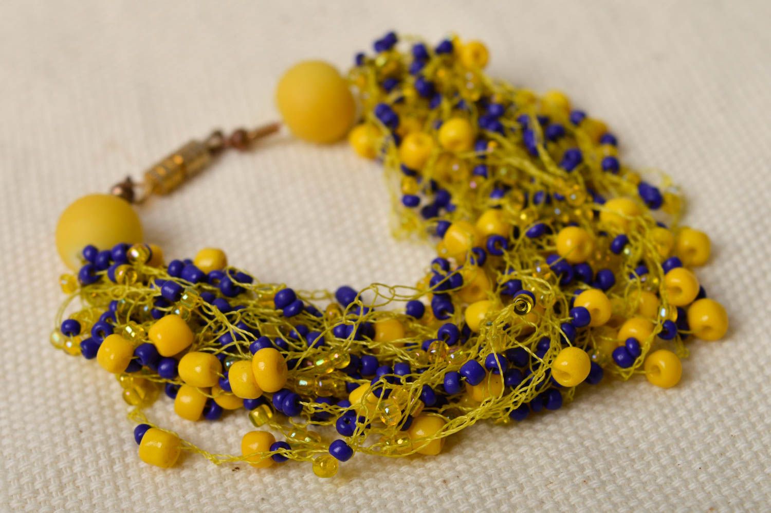 Yellow and blue beads bracelet on the thin yellow cord for women photo 1