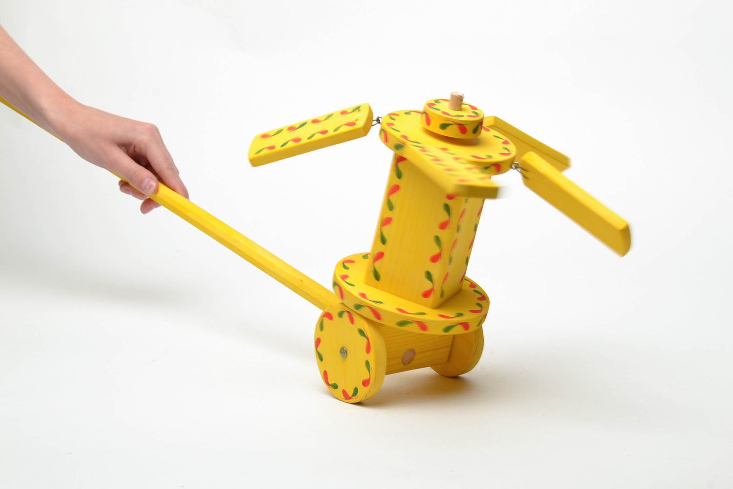 Painted wooden toy with wheels  photo 5