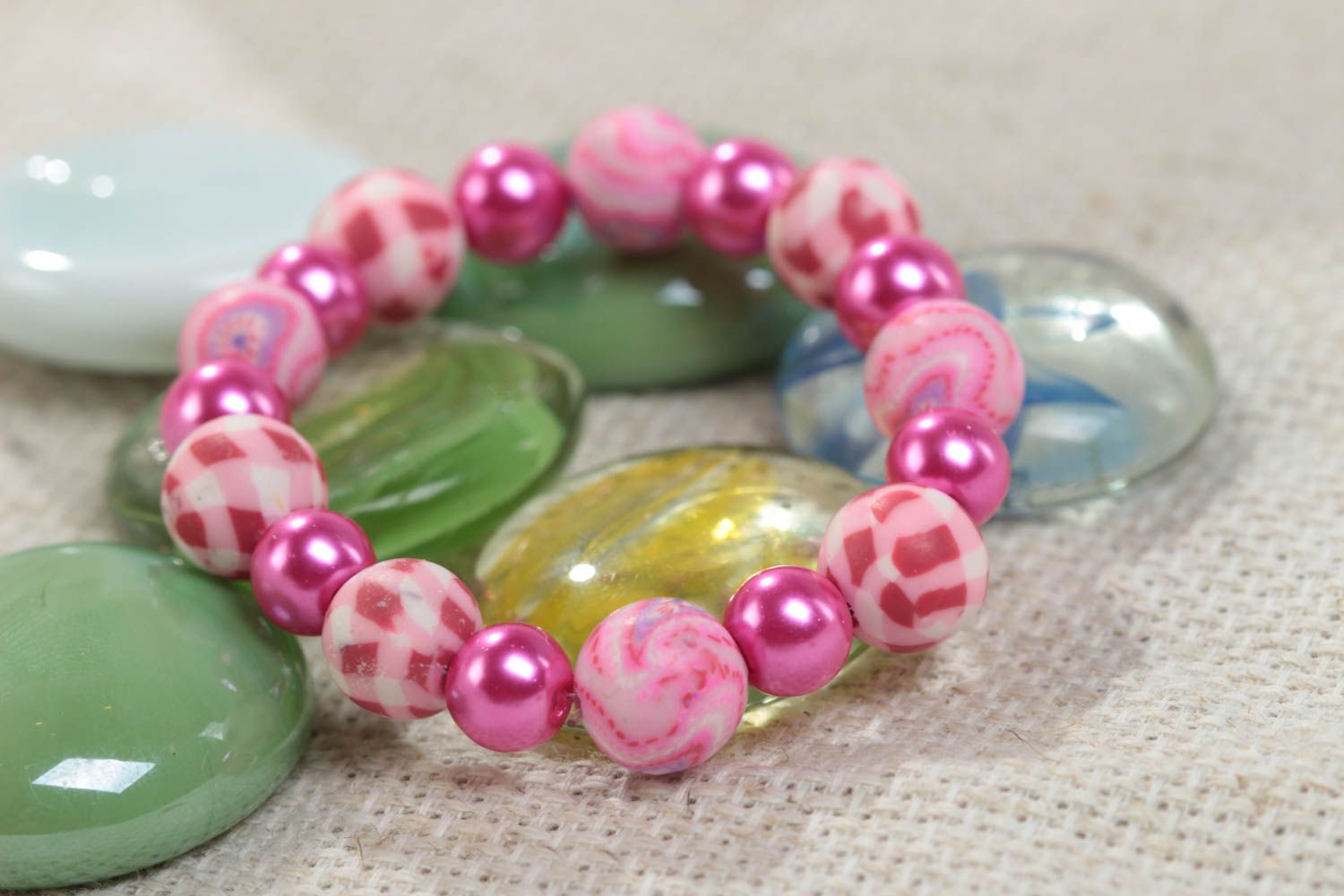 Pink children's handmade designer plastic bracelet with beads on elastic band photo 1