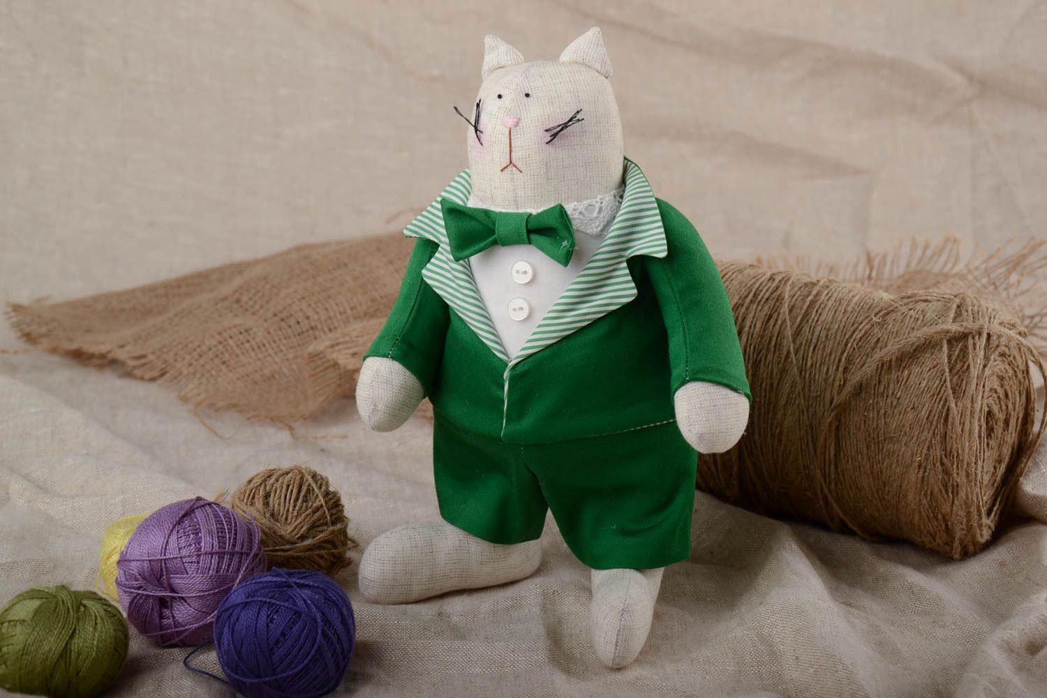 Handmade designer soft toy sewn of cotton fabric fat cat in green business suit photo 1