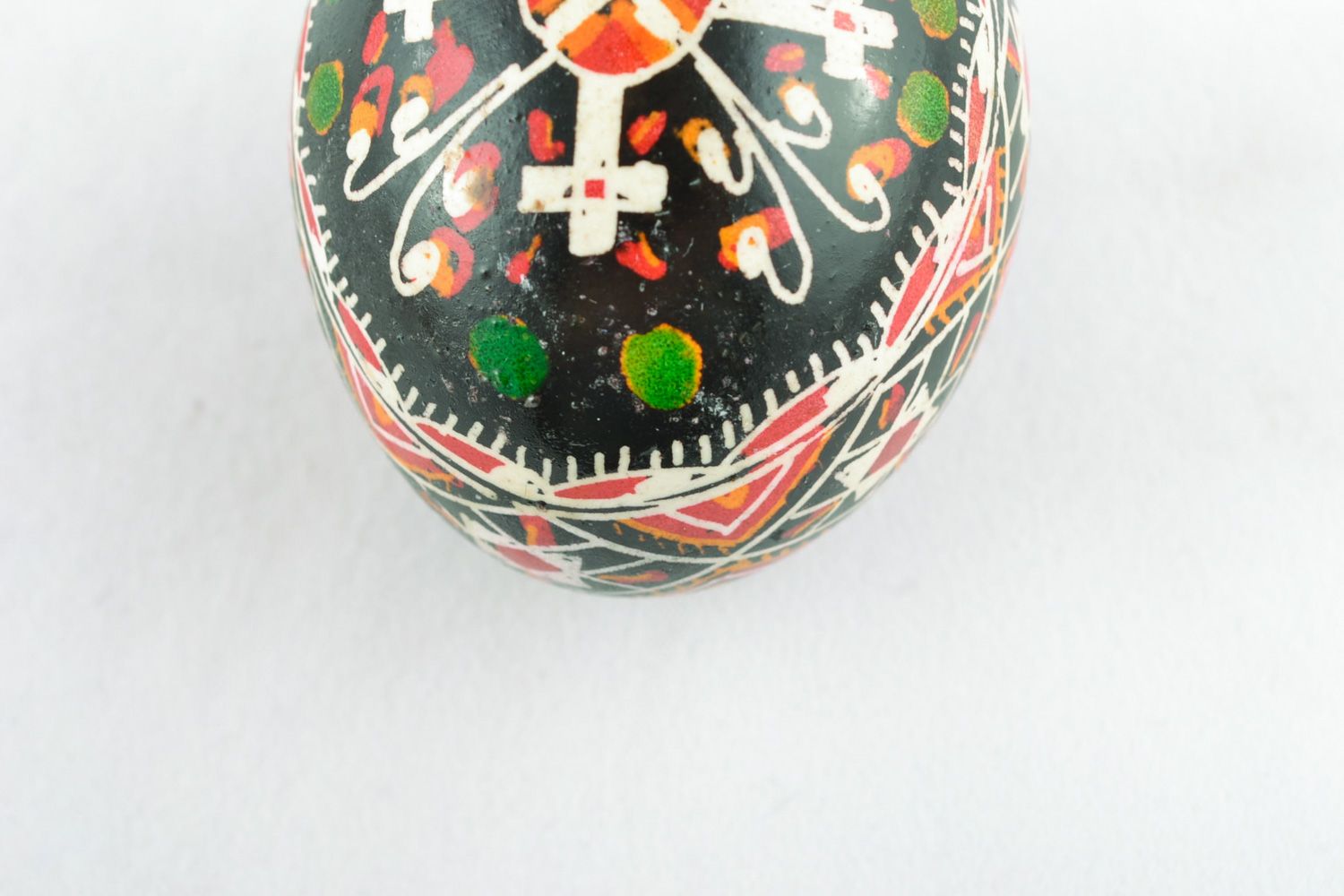 Handmade Easter egg with cross-shaped ornament painted with wax and aniline dyes photo 4