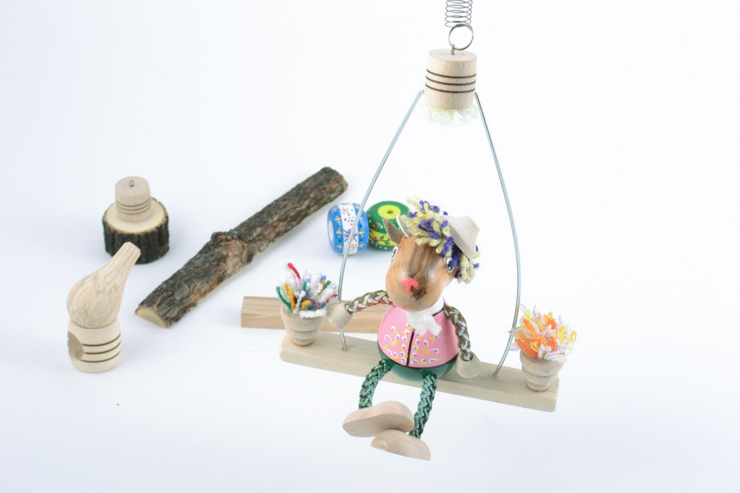 Eco friendly wooden handmade toy goat on a swing with painting funny toys for kids photo 2