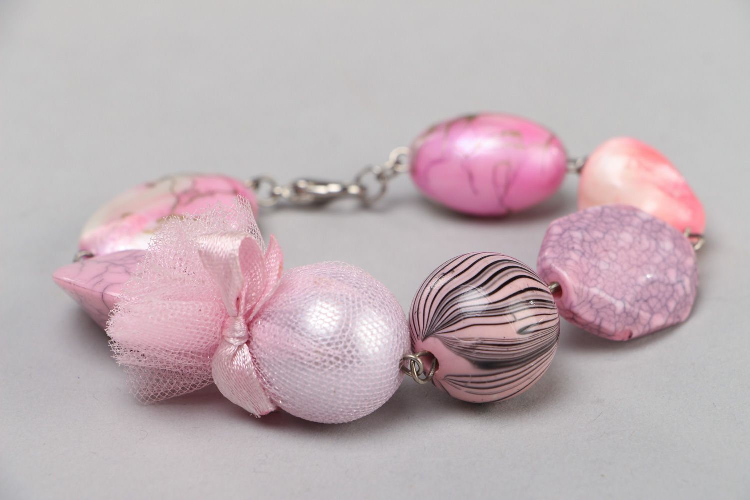 Massive handmade wrist bracelet with light pink plastic beads and metal lock photo 1