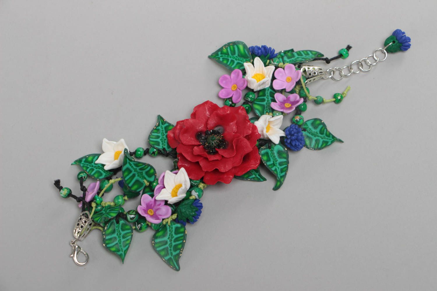 Handmade summer bracelet made of polymer clay with different flowers on chain photo 1