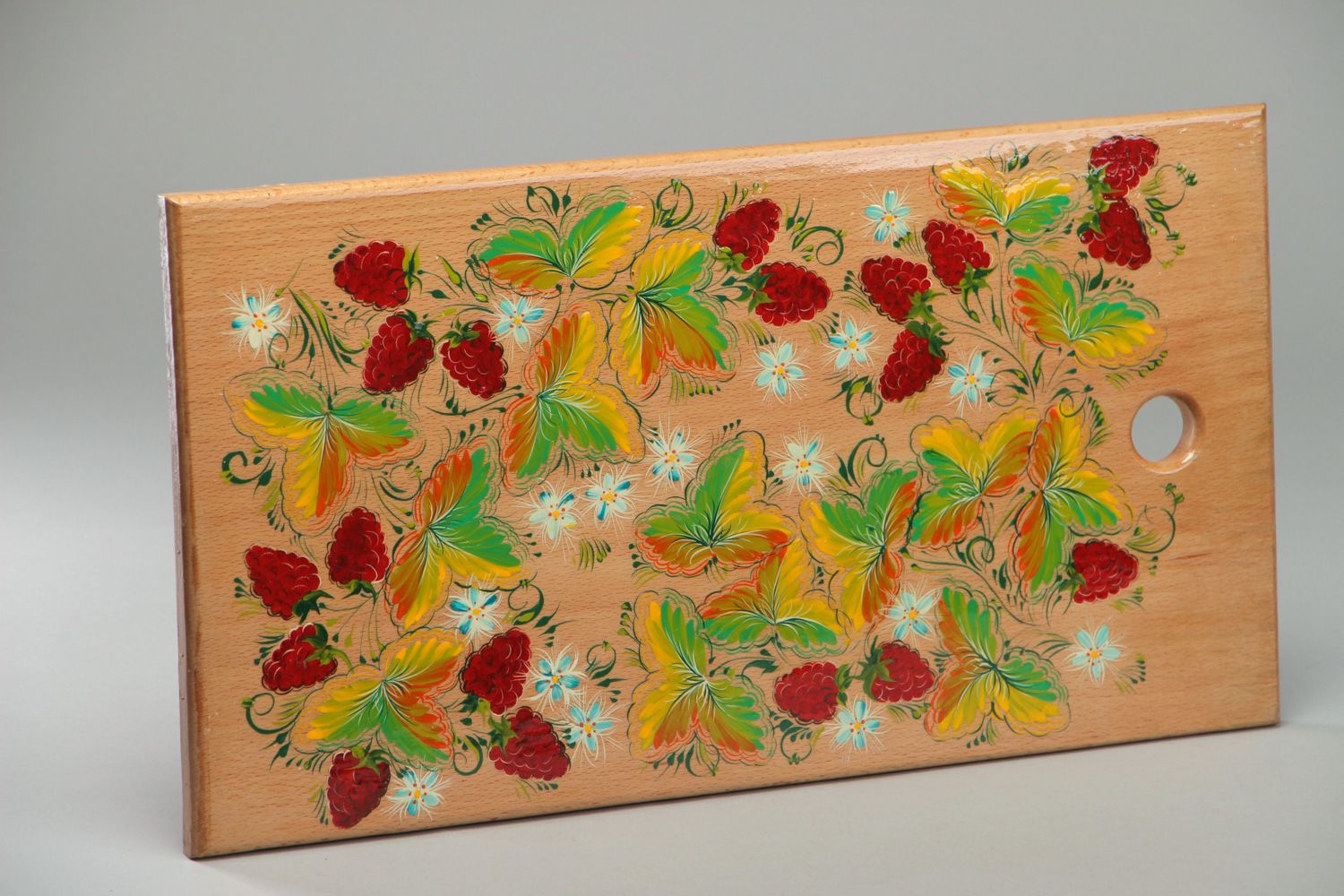 Handmade decorative wooden cutting board with Petrikivka painting in ethnic style photo 1