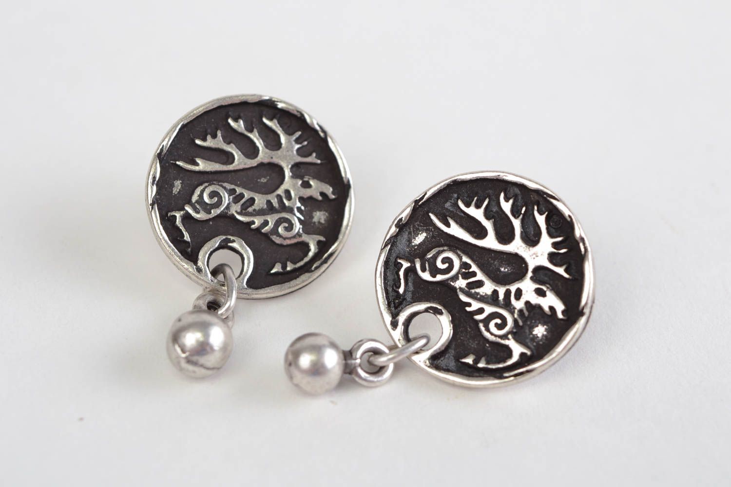 Handmade small round stud earrings cast of hypoallergenic metal with deer image photo 4