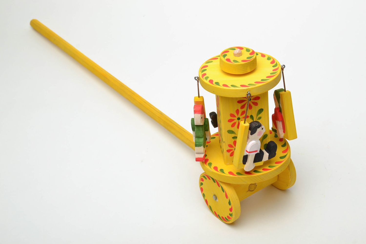 Wooden wheeled toy with Ukrainian ethnic painting photo 4