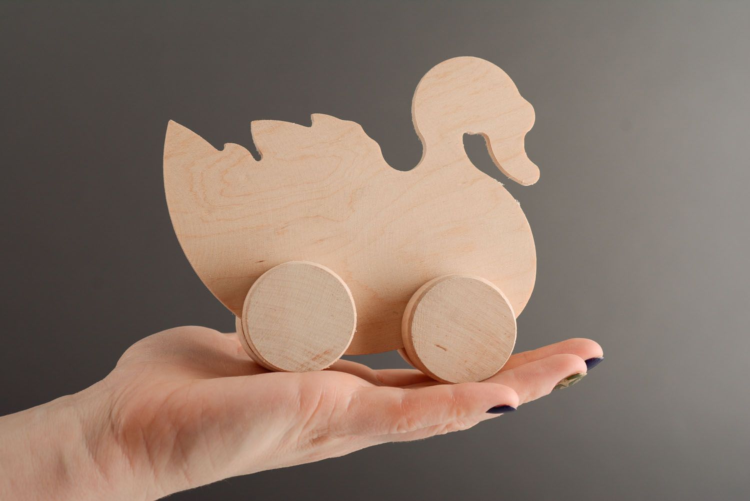 Wooden toy with wheels Swan photo 3