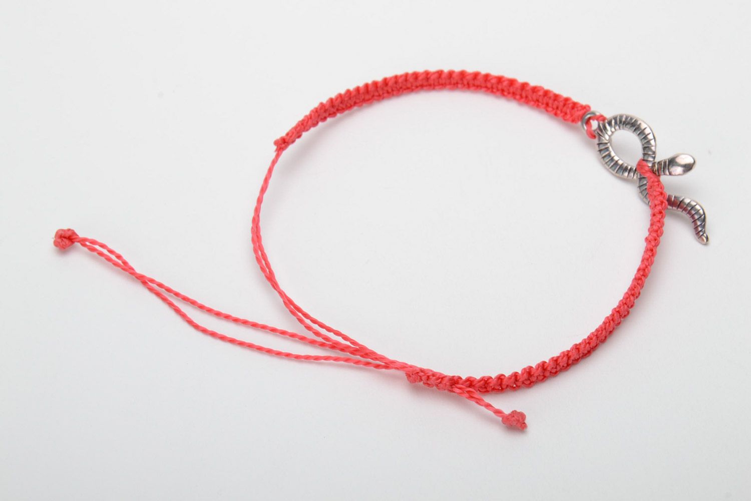 Handmade designer women's macrame bracelet of red color with metal snake charm photo 4