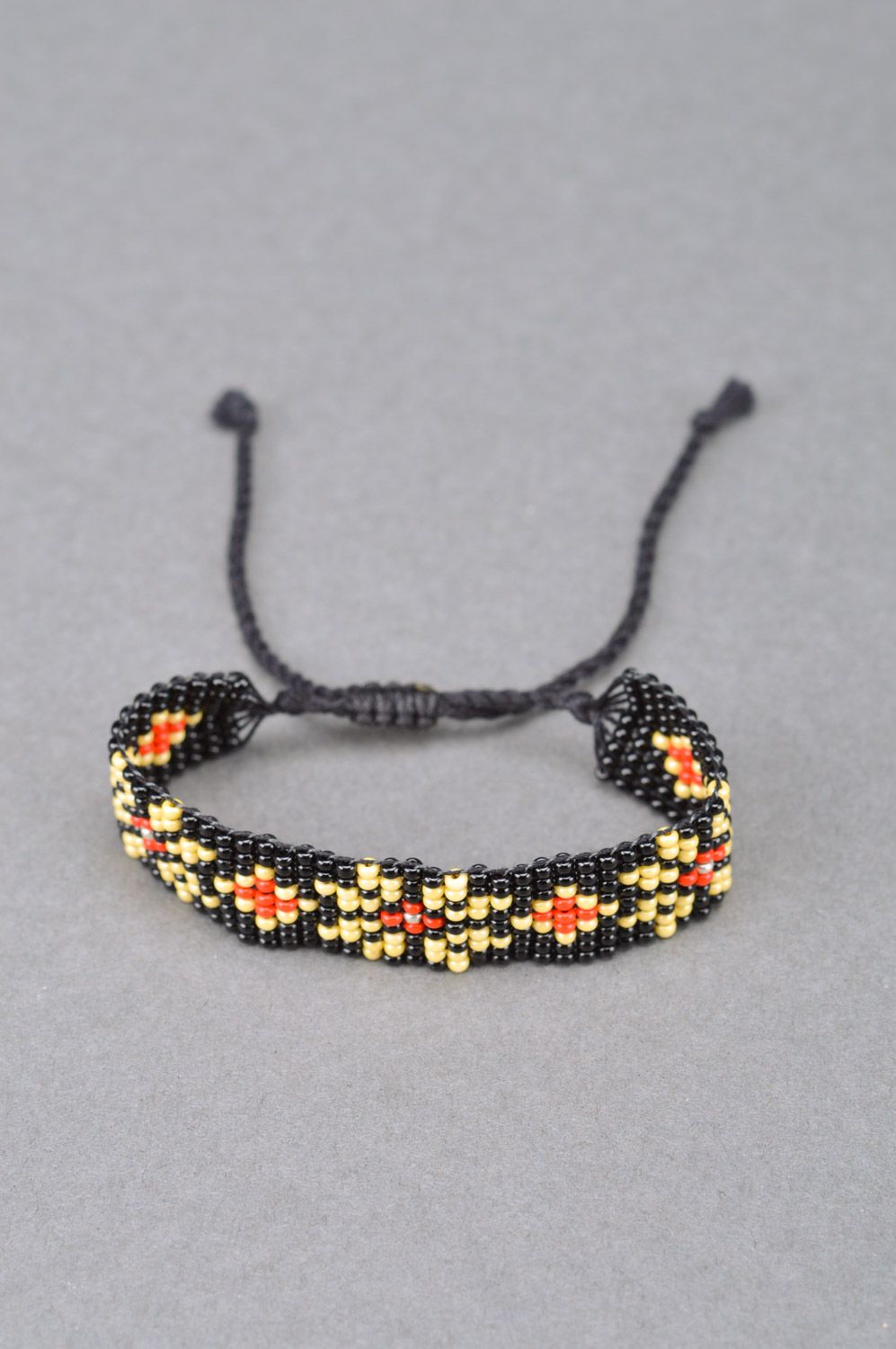 Handmade black wide beaded wrist bracelet with yellow and red flowers photo 5