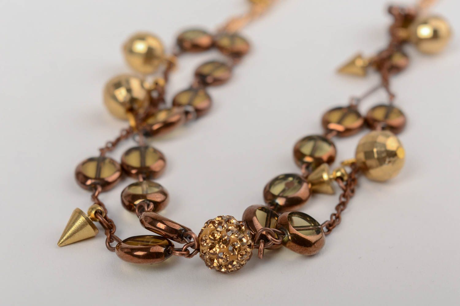 Handmade long elegant golden colored necklace with glass beads on metal chain photo 2