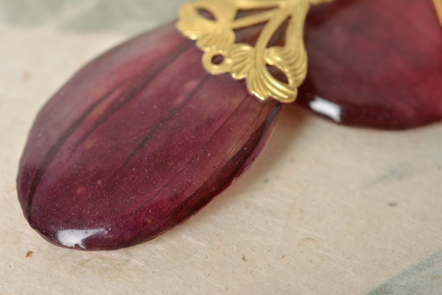 Handmade designer earrings with dark purple flower petals in epoxy resin photo 3