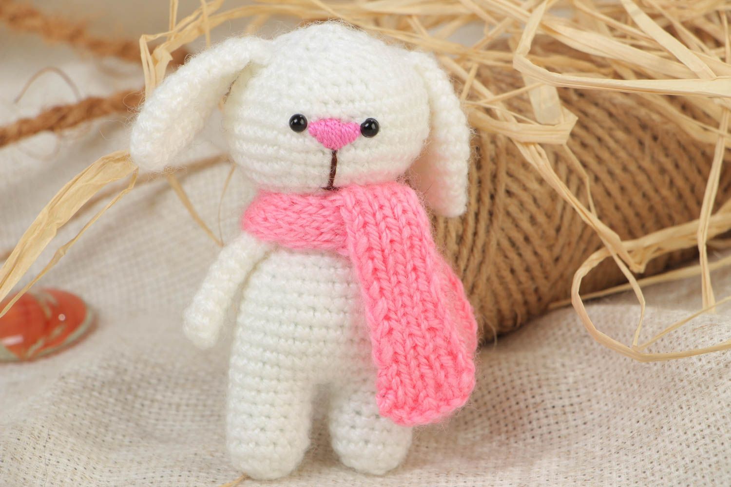 Handmade soft toy crocheted of acrylic threads white rabbit with pink scarf photo 1