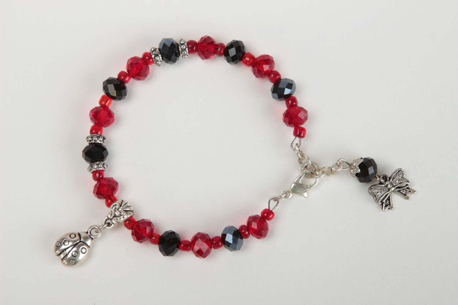 Dark red and black beads bracelet with silver ladybug charm for girls photo 2