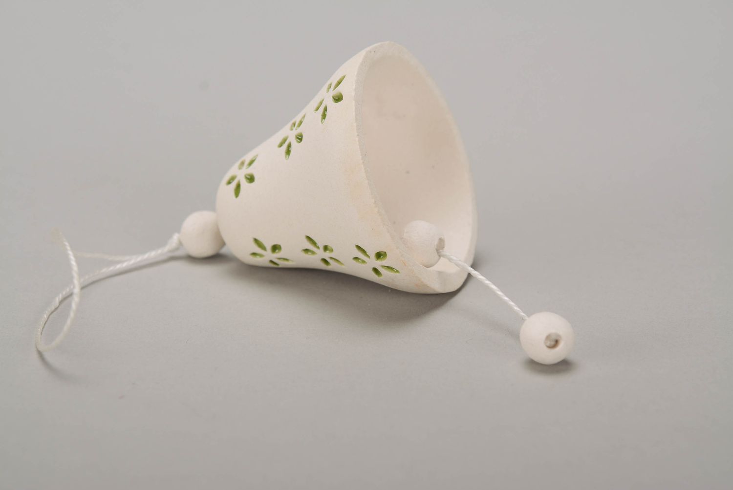 Bell made from white clay photo 4