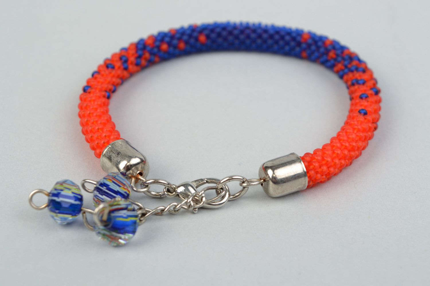 Handmade cord bracelet woven of bright red and blue Czech beads for women photo 4