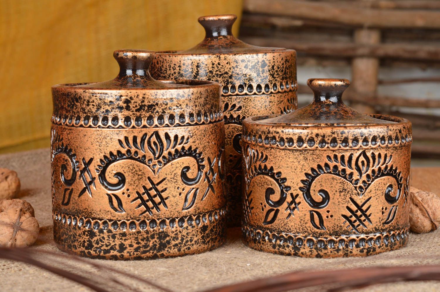 Set of three stylish handmade ceramic brown pots with covers for kitchen decor photo 1
