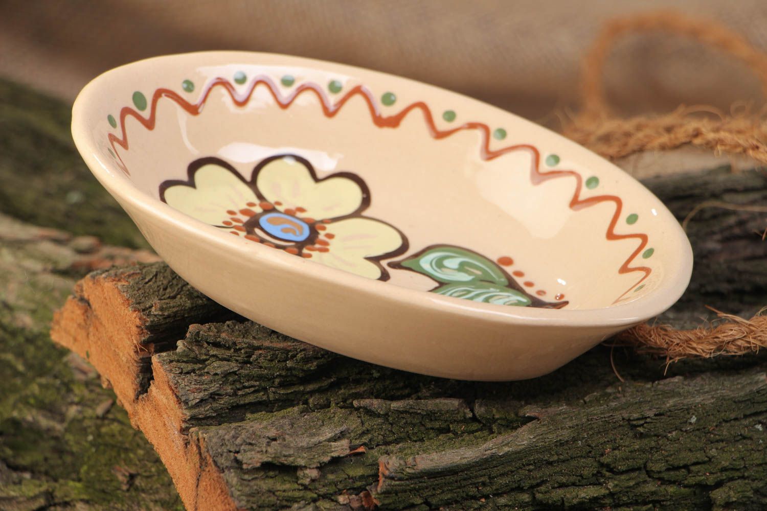 Handmade oblong ceramic bowl painted in ethnic style and coated with glaze photo 1