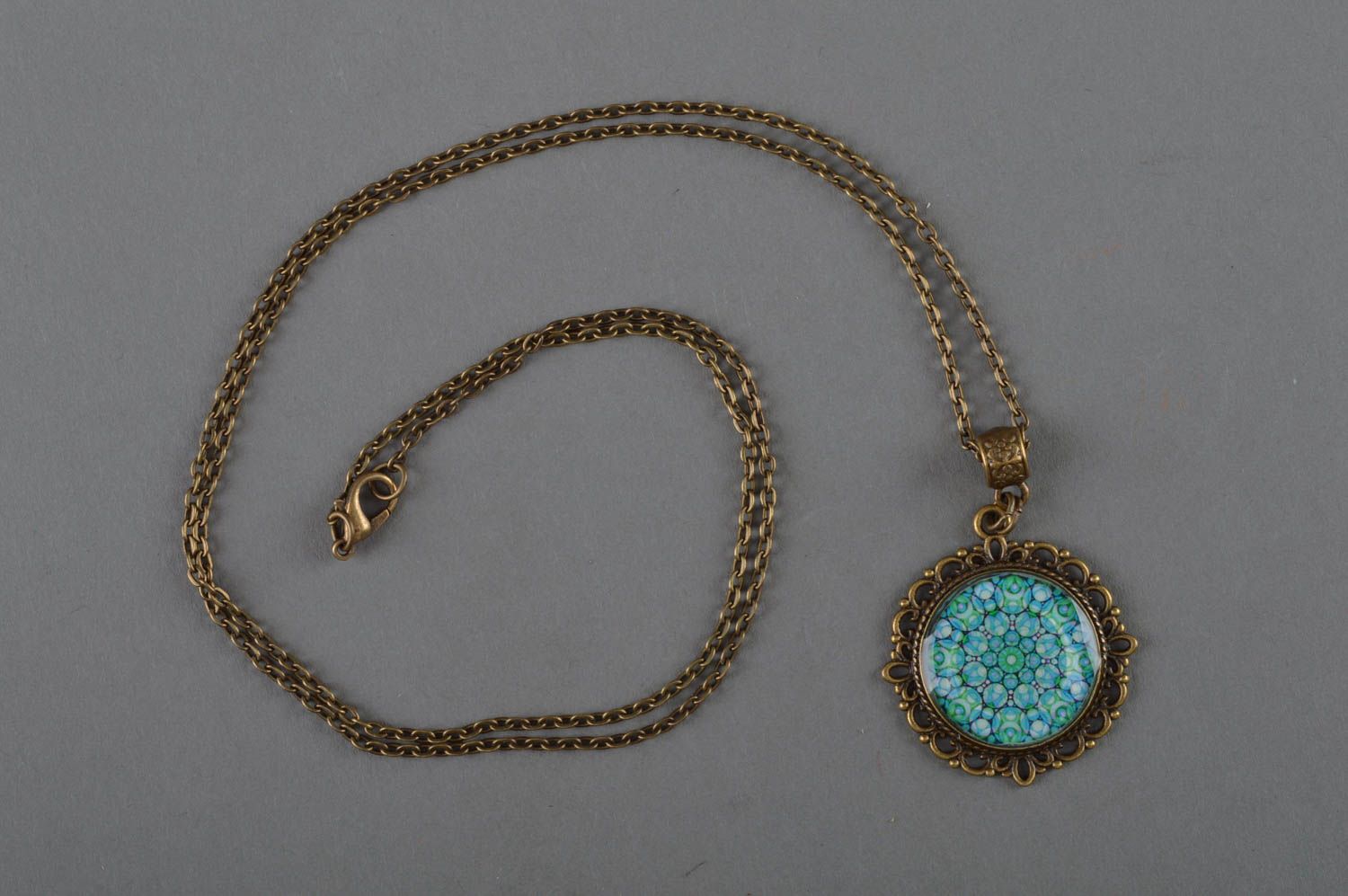Epoxy-coated round handmade blue pendant with flower print stylish accessory photo 1