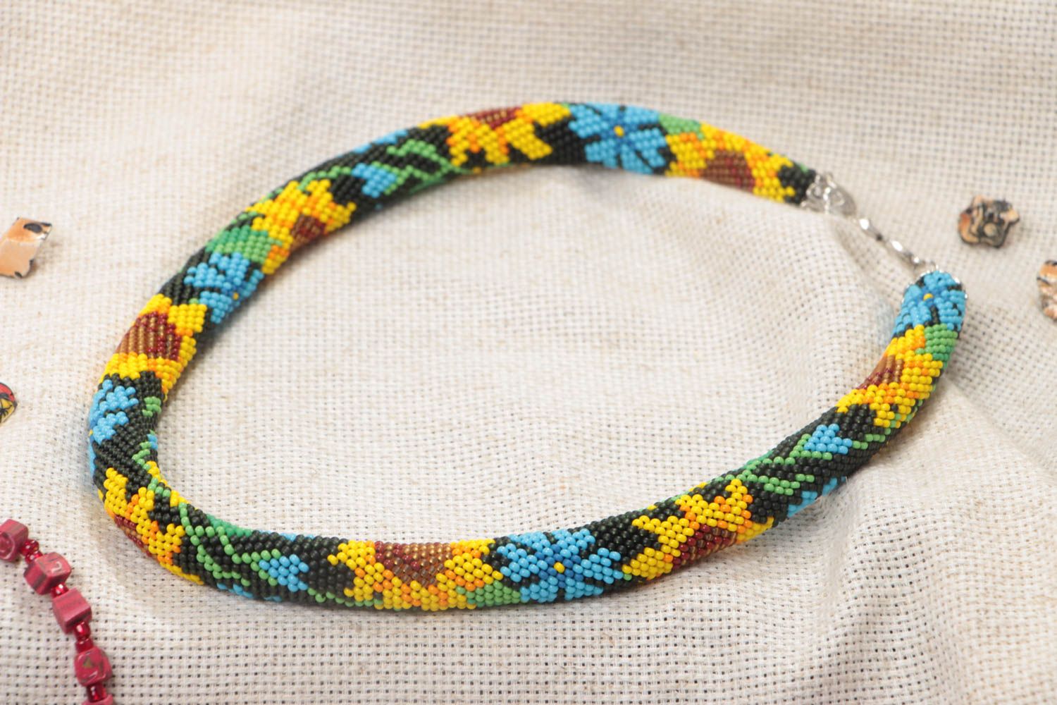 Handmade designer bead woven cord necklace with sunflowers on black background photo 1