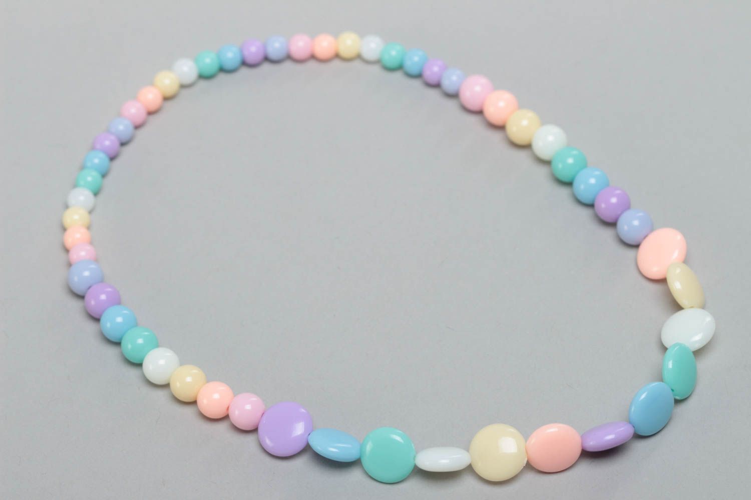 Handmade designer long children's plastic bead necklace of pastel colors photo 2