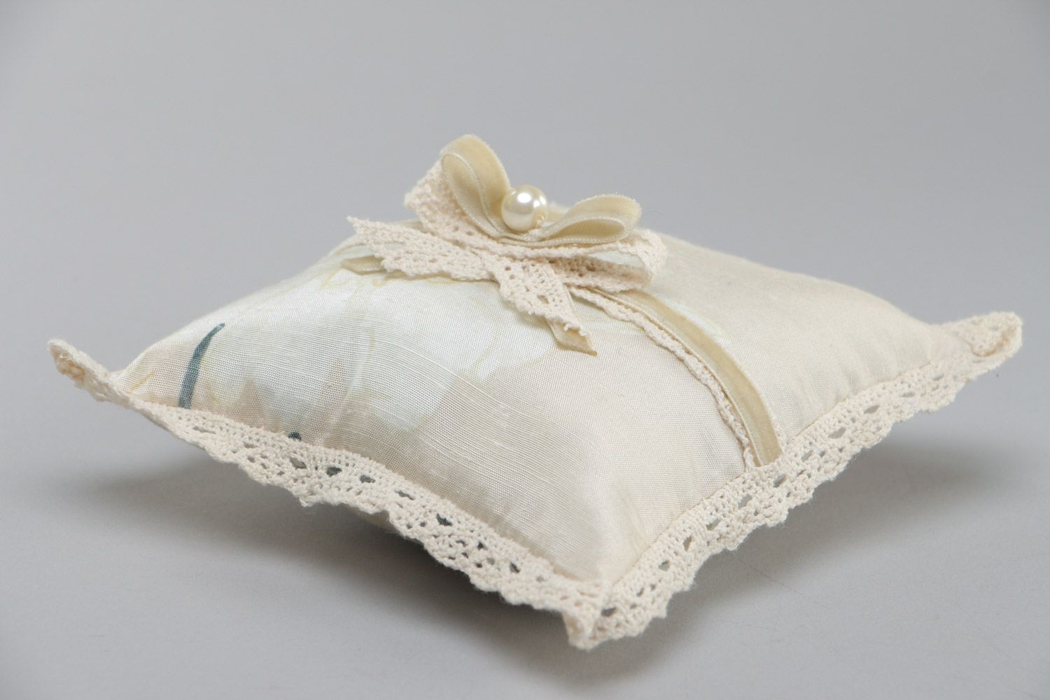 Handmade wedding ring bearer pillow sewn of ivory-colored silk fabric with bow photo 3