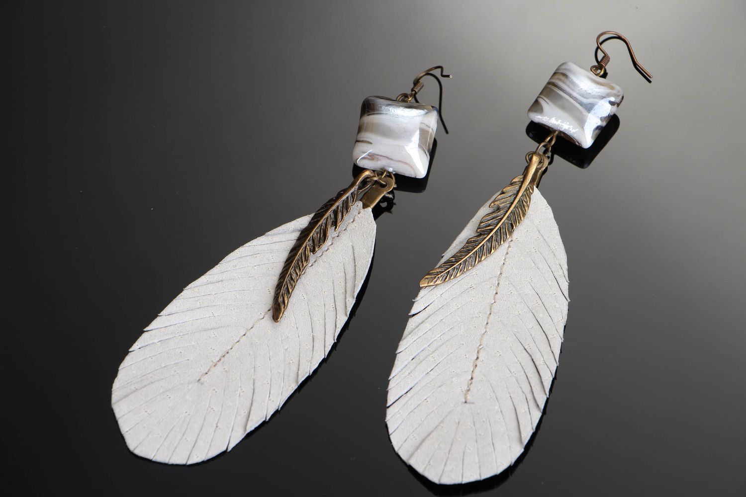 Long earrings with white feather photo 1