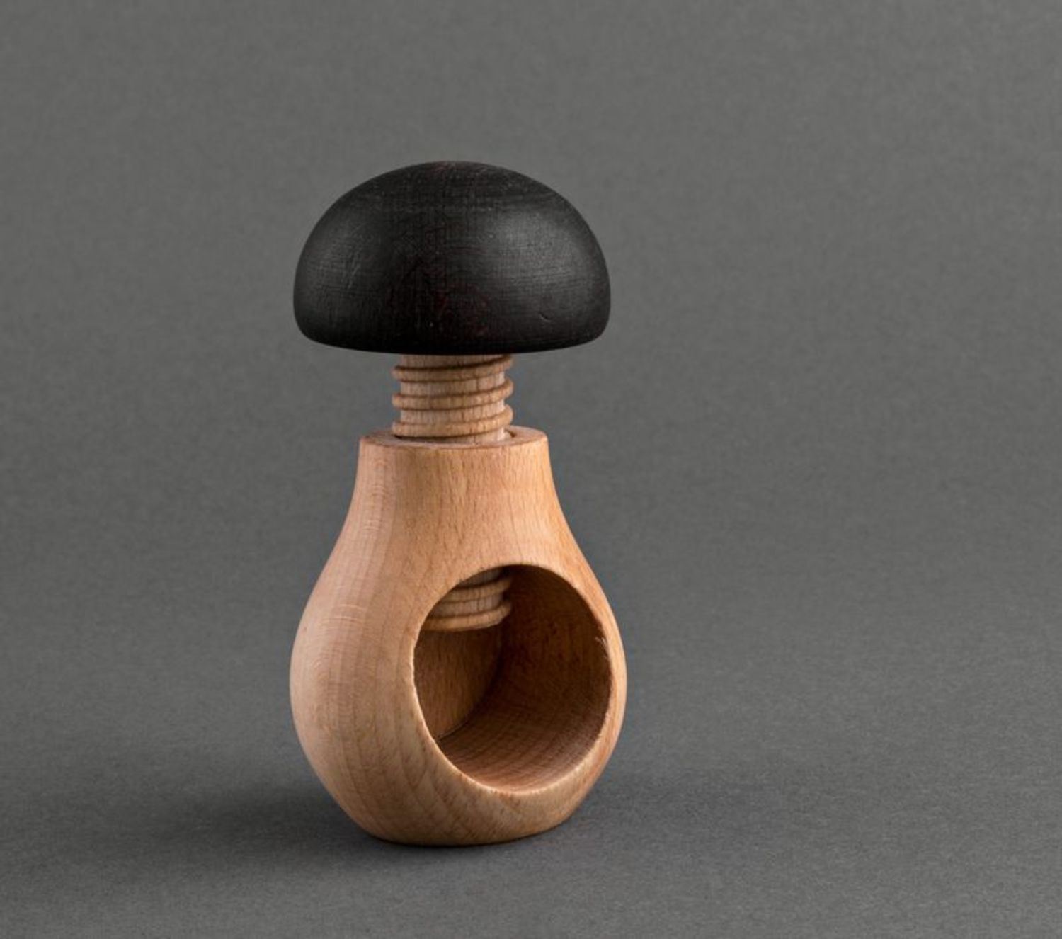Wooden nutcracker in the shape of a mushroom photo 2